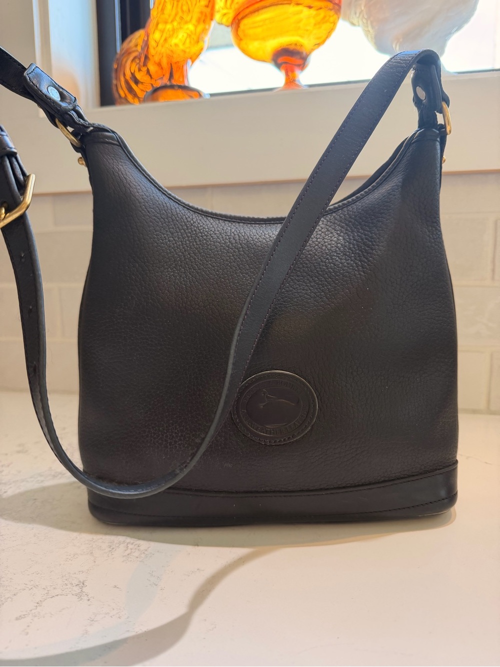 Dooney & Bourke Black Leather Shoulder Bag with Embossed Logo